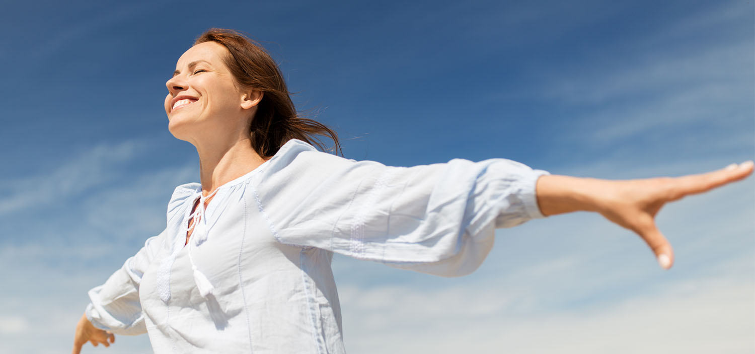 Woman enjoying the feeling of freedom in the fresh air